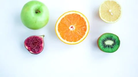 Background of fresh sliced fruit on a table in the afterno Stock Photos