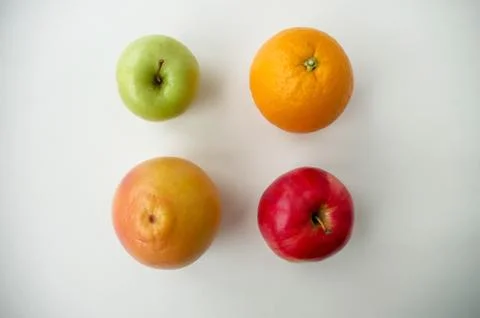 Background of fresh sliced fruit on a table in the afterno Stock Photos