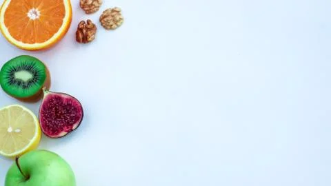 Background of fresh sliced fruit on a table in the afterno Stock Photos
