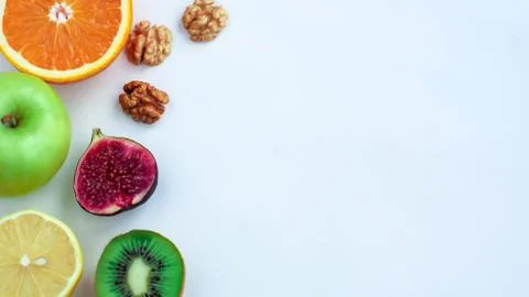 Background of fresh sliced ââfruit on a table in the afterno Stock Photos