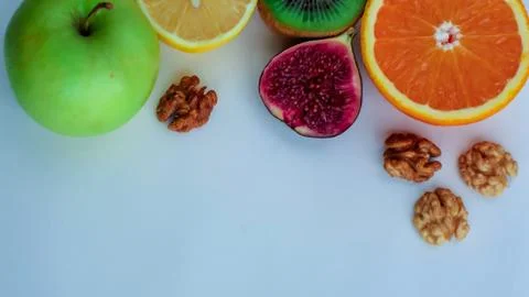 Background of fresh sliced ââfruit on a table in the afterno Stock Photos