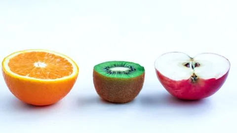 Background of fresh sliced fruit on a table in the afterno Stock Photos