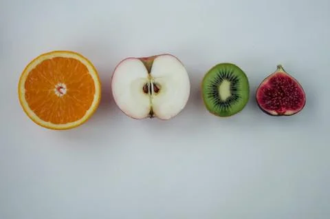 Background of fresh sliced fruit on a table in the afterno Stock Photos