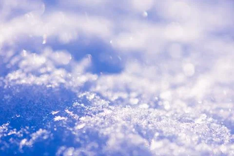 Background of fresh snow texture in blue tone. Snowfall texture background. Stock Photos