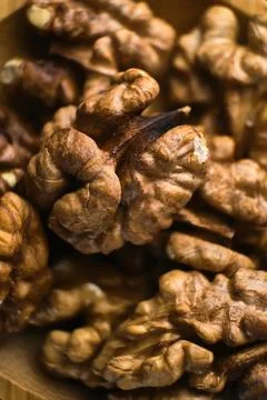 Background of fresh walnuts. Selective focus, macro Stock Photos