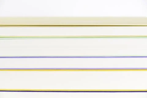 Background, front view of a stack of books. Colored lines and white stripes Stock Photos