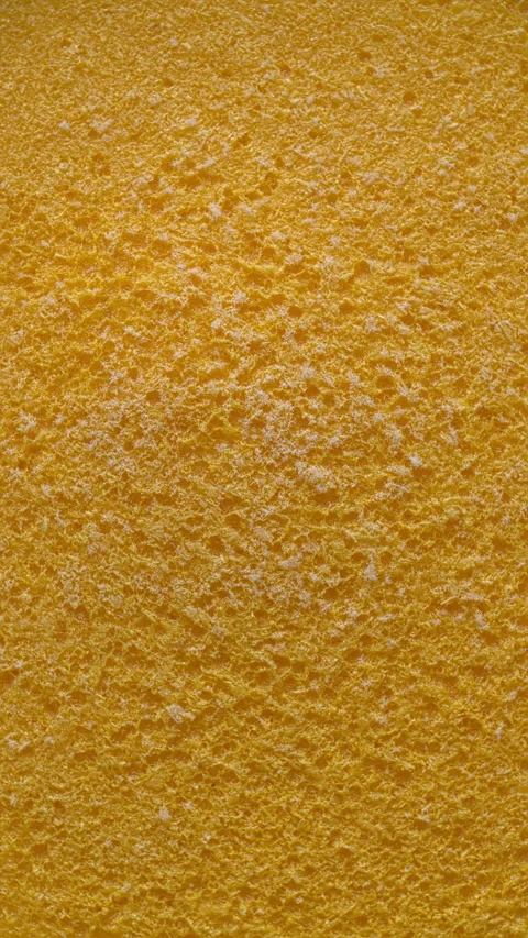 Background of frozen orange mousse. Vertical video. Stock Footage 311052278