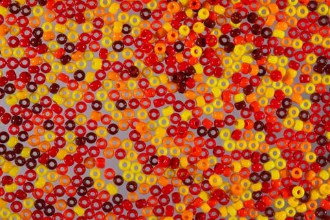 Background of glass beads for needlework. Macro shooting Stock-Fotos