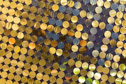 Background from golden sequins in matrix form. Concept of holidays, celebra.. Stock Photos