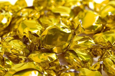 A Background of Golden Wrapped Candy Foto stock