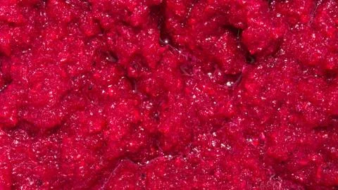 Background of grated beetroot.Beets ground in a blender. Stock Photos