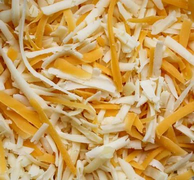The background of grated cheese. Abstract.  Stock Photos