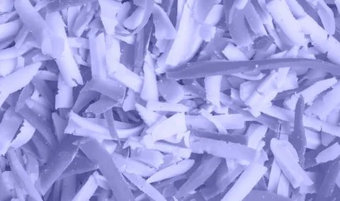 Background of grated cheese colored in new trendy color of 2022 year Very Peri Foto stock