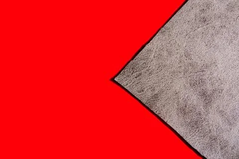 Background of a gray cloth on a red surface Foto stock