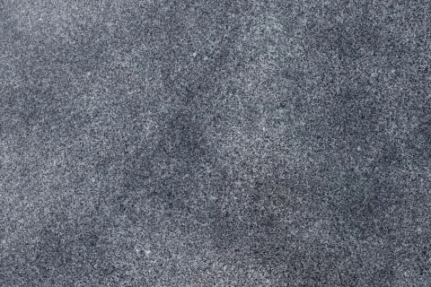 Background of gray granite with an interesting texture Stock Photos