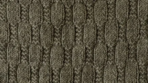 Background with gray knitted sweater texture leaf shape pattern, cables. Stock Footage 256968515