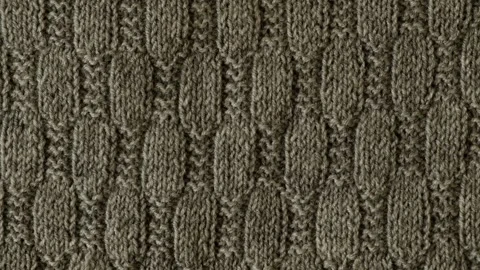 Background with gray knitted sweater texture leaf shape pattern, cables. Stock Footage 257069392