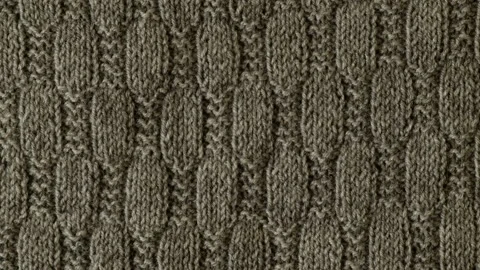 Background with gray knitted sweater texture leaf shape pattern, cables. Stock Footage 257069419