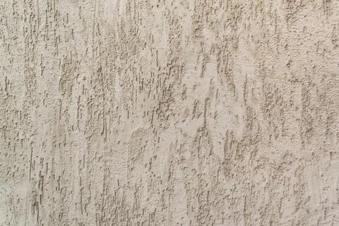 Background of gray one-color facade plaster. Single-layer cement monolithic Stock Photos