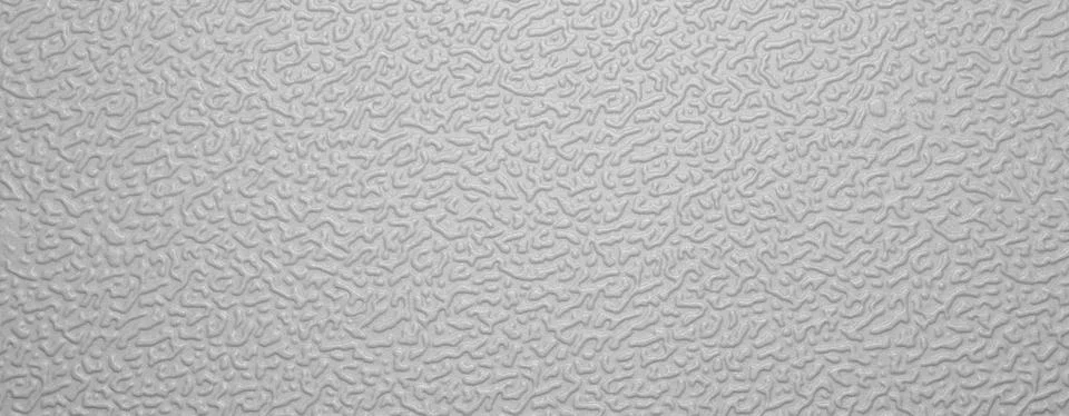 Background of gray rough plastic top view.Plastic matte surface. Stock Photos