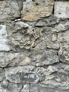 Background of gray stones with sharp edges, part of wall Stock Photos