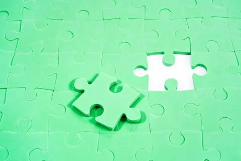 Background of green puzzles without one Stock Photos