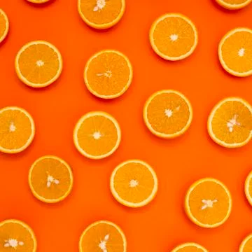 Background of half cut oranges on orange background Stock Photos