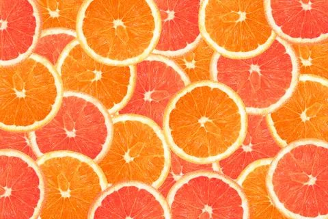 Background of half cut oranges on orange background Stock Photos