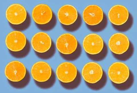 Background of half cut organic oranges in row Stock Photos