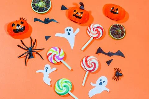Background with a Halloween theme, with scary ghosts, lollipops and scary p.. Stock Photos