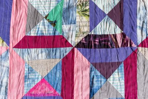 Background from hand-crafted silk patchwork fabric Stockfoto's