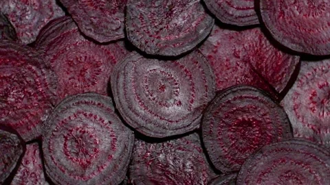 Background of heap fresh colorful beetroot slices Stock Footage 220684814