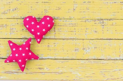 Background with heart and star on rustic wood Stock Photos