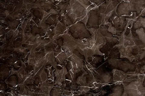 Background, highly detailed texture of brown granite rock, natural pattern. Stock Photos