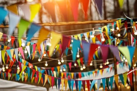 Background from holiday flags. Many colored flags and lanterns Stock Photos