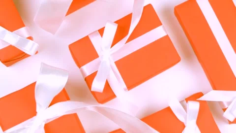 Background with holiday gift boxes in different colors with ribbons and bows or Stock Footage 270492210