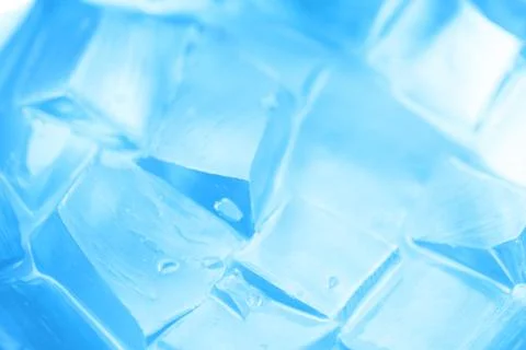 Background with ice cubes in blue light Stock Photos