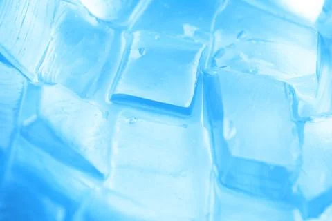 Background with ice cubes in blue light Stock Photos