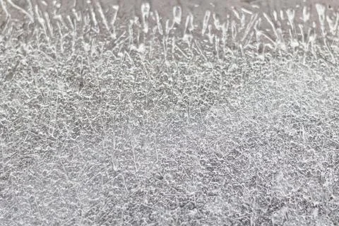 Background from ice on the surface of the pond. Winter season Stock Photos