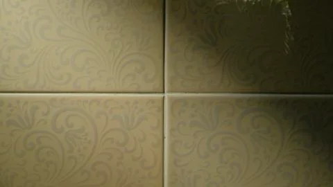 The background image of the bathroom tile with light coming in. Stock-Fotos