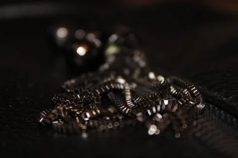 The background image is black with beads. Stock Photos