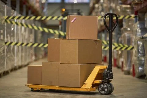 Background image of boxes stacked in commercial warehouse Stock Photos