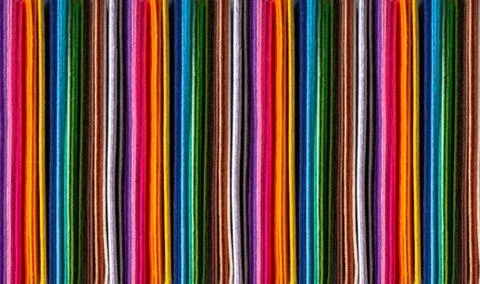 Background image of bright colored felt pieces large Stock Photos