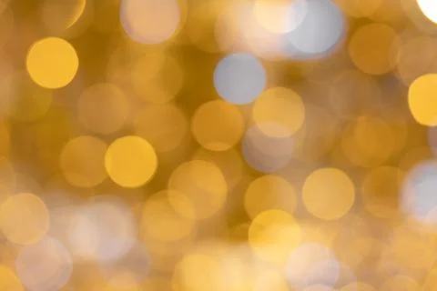 Background image of bright iridescent yellow and white bokeh colors. Optical Stock Photos