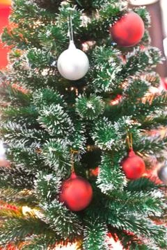 Background image of a christmas tree decorated with lights Stock Photos