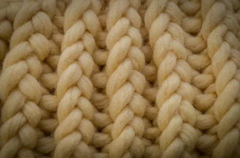 Background image with a close-up of the hairs on the pigtail loops of beige yarn Stock Photos