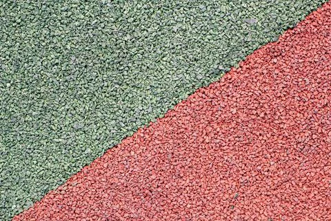 Background image of a colored rubber surface for sports fields Stock Photos
