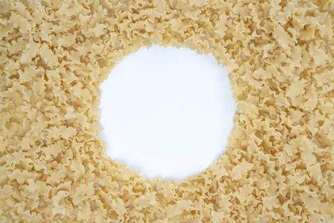 Background image with dry mini lasagna noodles with copy space on the center Stock Photos