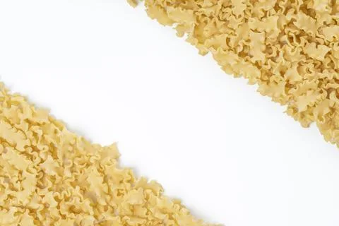 Background image with dry mini lasagna noodles with copy space on the center Stock Photos