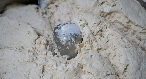 BACKGROUND IMAGE OF FLOUR GETTING MIXED IN THE FLOUR MACHINE. Stock Photos